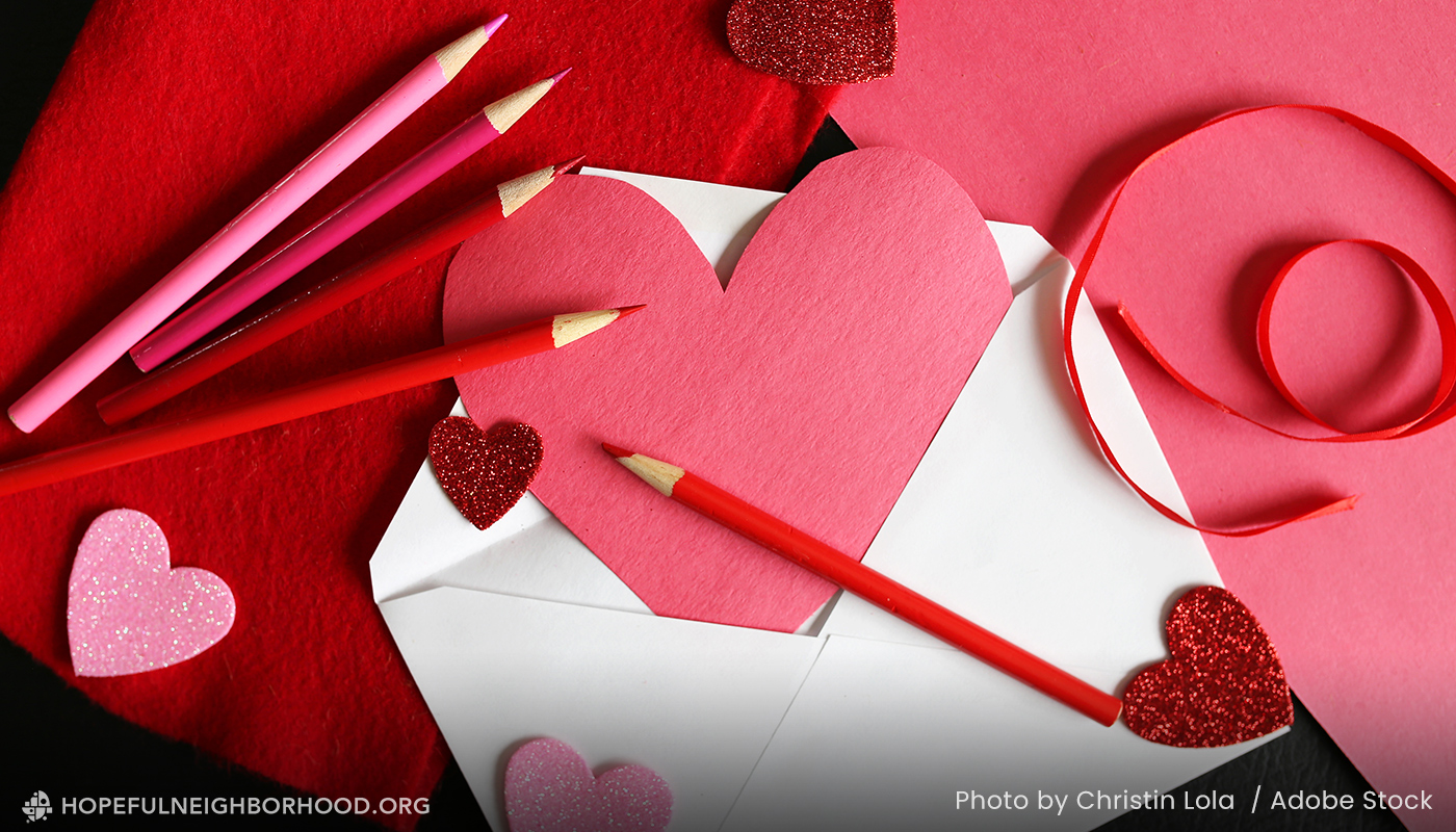 Photo of cards made from cut red and pink hearts with red and pink colored pencils.